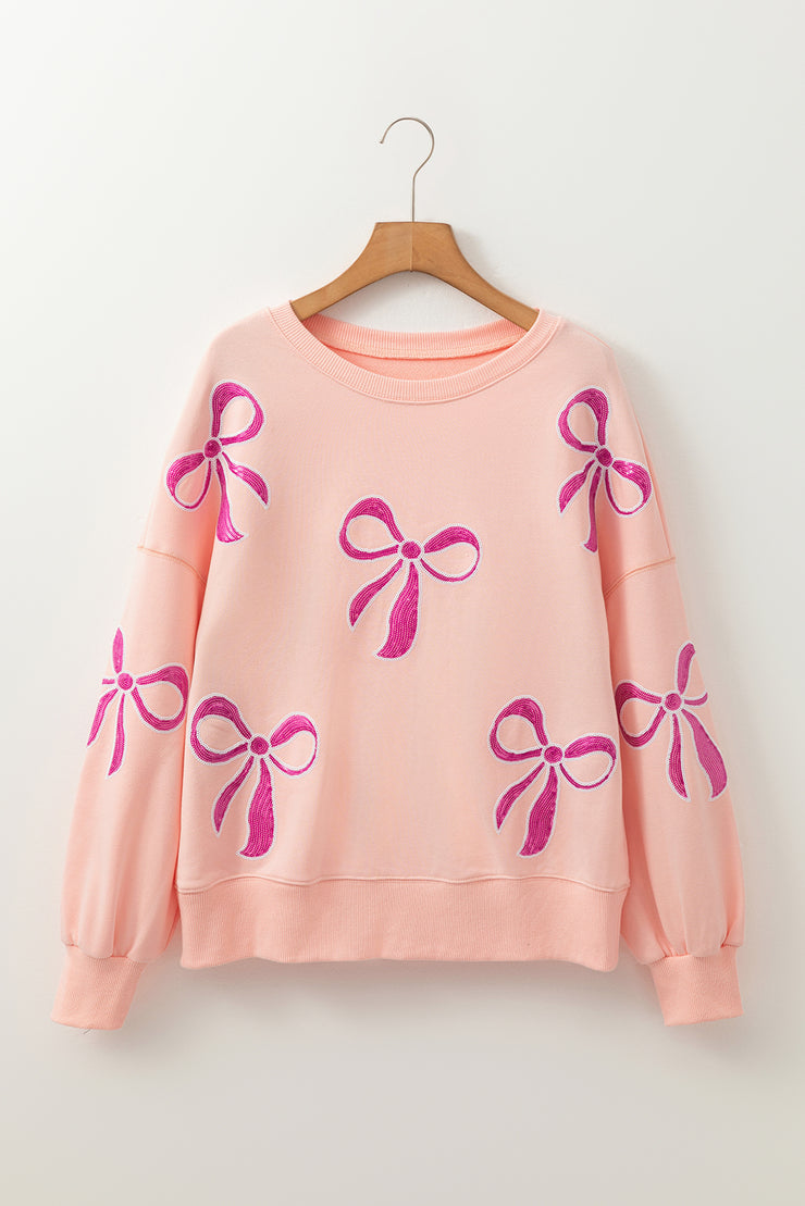 Apricot Pink Sequined Bowknot Drop Shoulder Oversized Sweatshirt