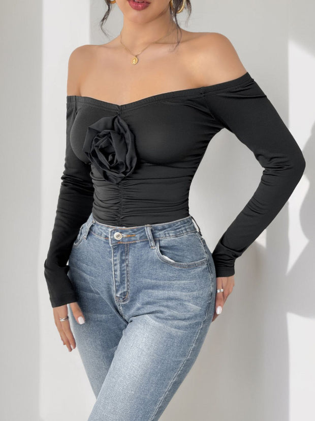 Perfee Ruched Flower Off-Shoulder Long Sleeve Bodysuit